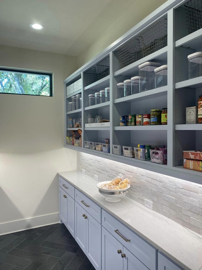 Organized pantry with clear containers.