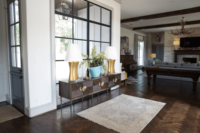 foyer cabinet with plant and lamps